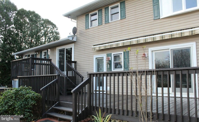 back of house featuring a deck