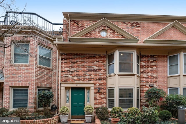 view of front of home featuring brick siding