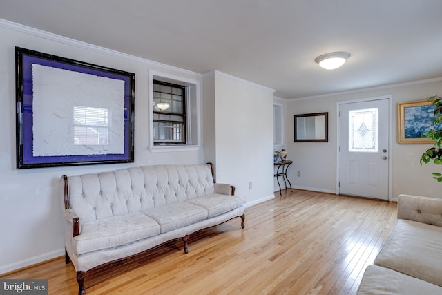 interior space featuring light hardwood / wood-style floors and crown molding