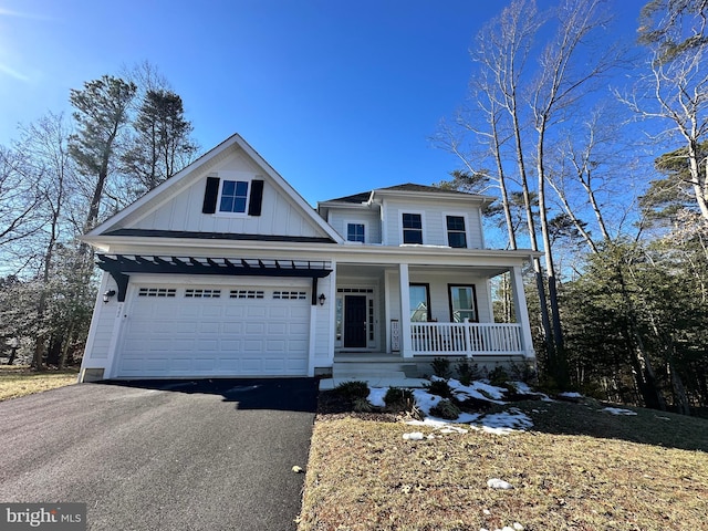 view of front of home with a garage and a porch