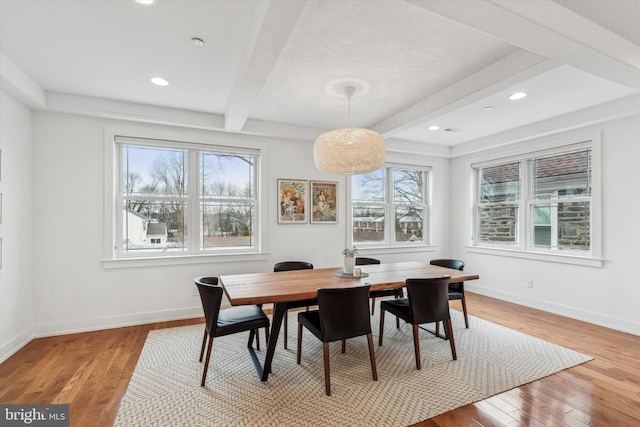 dining room with light wood-style floors, recessed lighting, beamed ceiling, and baseboards