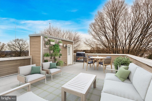 view of patio / terrace featuring a grill, an outdoor living space, and outdoor dining space