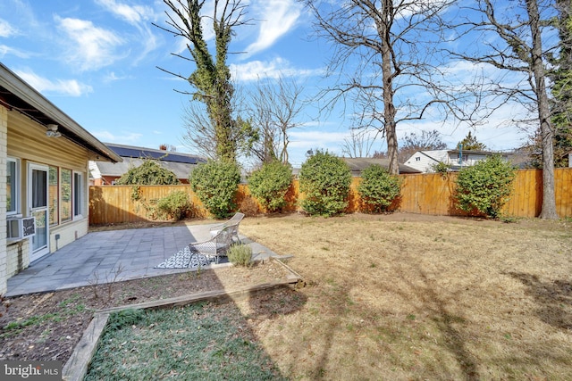 view of yard featuring a patio, cooling unit, and a fenced backyard