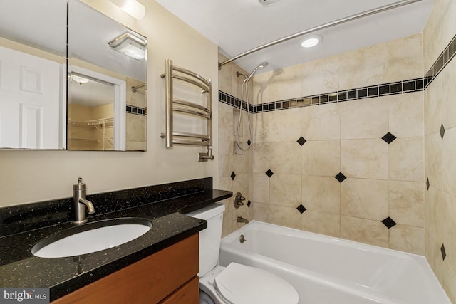 bathroom with toilet, shower / bath combination, and vanity
