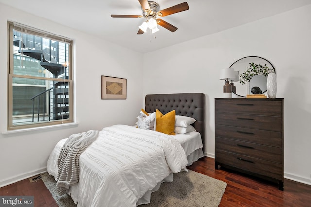 bedroom featuring dark wood-type flooring and ceiling fan