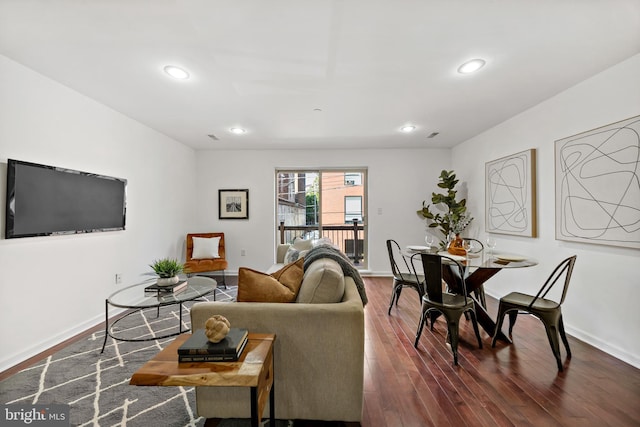 living room with dark hardwood / wood-style floors