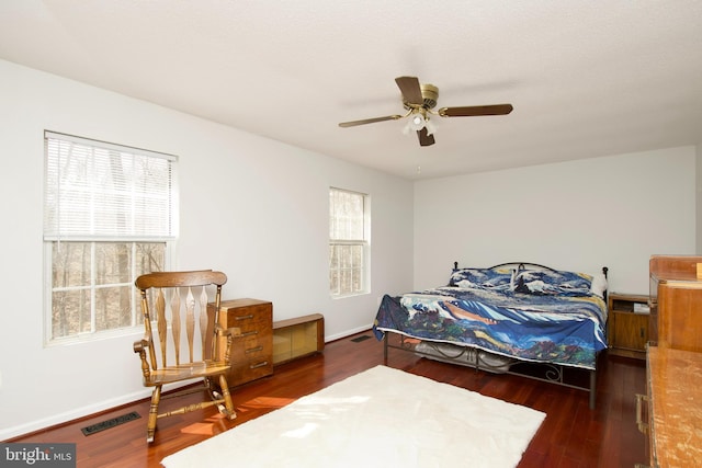 bedroom featuring ceiling fan and dark hardwood / wood-style floors