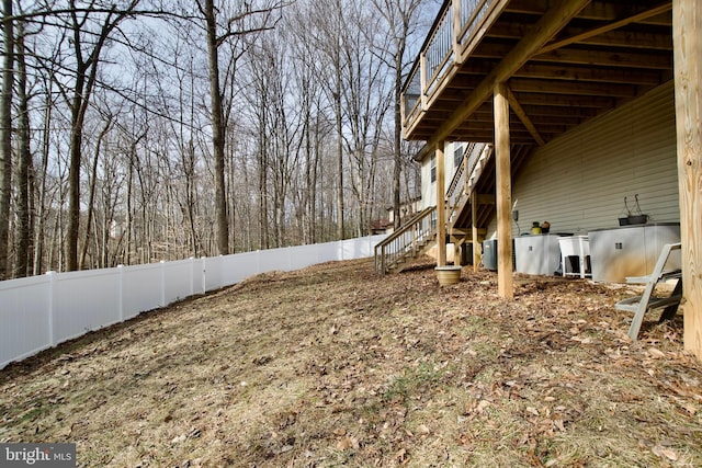 view of yard with central AC