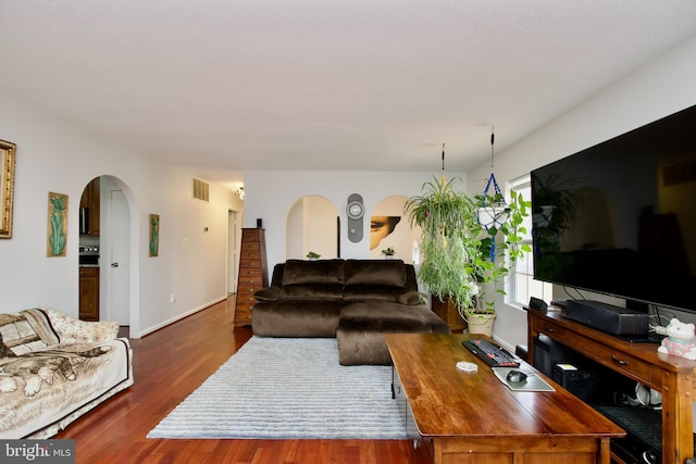 living room featuring dark hardwood / wood-style floors