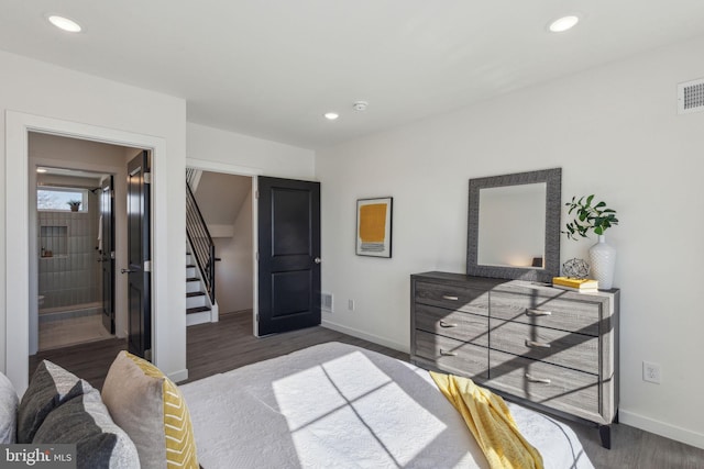 bedroom with visible vents, baseboards, wood finished floors, and recessed lighting