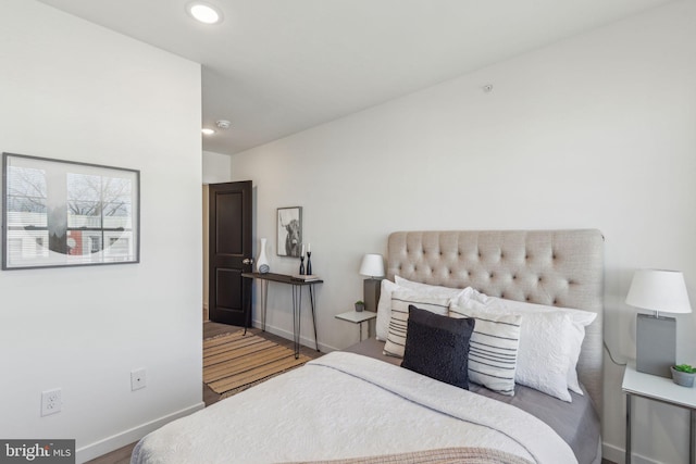 bedroom with recessed lighting and baseboards