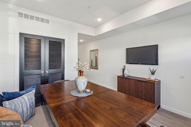 dining space with recessed lighting, visible vents, baseboards, and wood finished floors