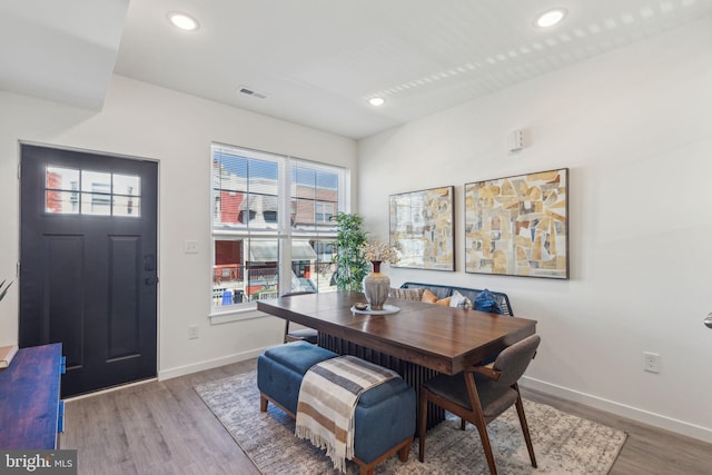 dining room featuring recessed lighting, visible vents, baseboards, and wood finished floors