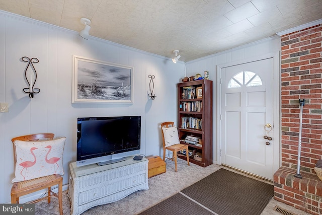 foyer entrance featuring carpet floors