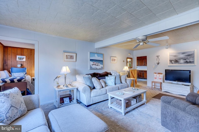 living room with a ceiling fan and carpet floors