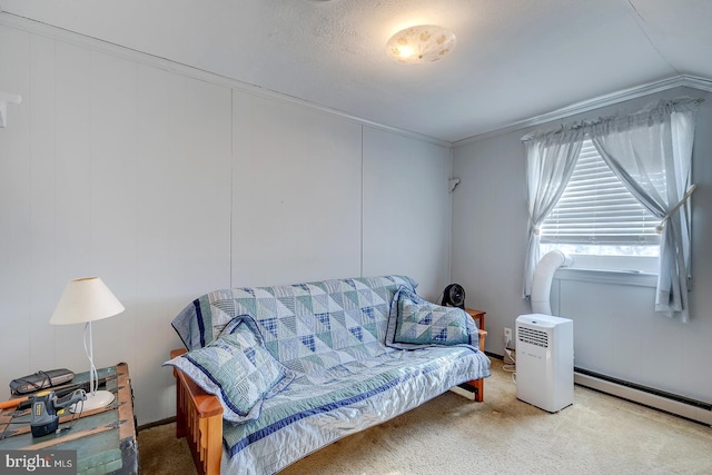 sitting room with carpet flooring, baseboard heating, and ornamental molding