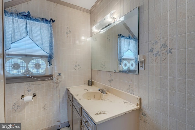 bathroom with tile walls and vanity