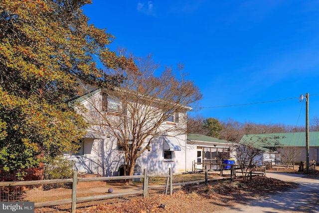 view of side of home with a fenced front yard