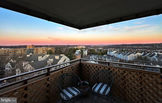 view of balcony at dusk