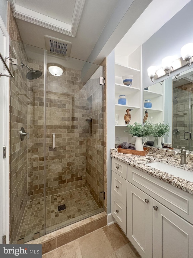 bathroom with vanity and an enclosed shower