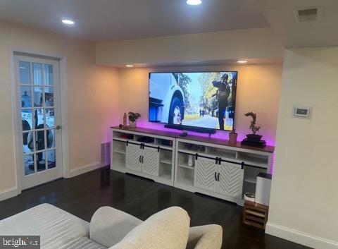 cinema room featuring dark hardwood / wood-style floors