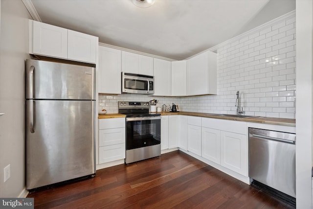 178 Elephant Rd Unit B21, Dublin, PA 18917 - kitchen with stainless steel appliances, butcher block countertops, a sink, and dark wood-type flooring