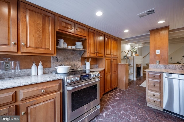 kitchen with brown cabinets, appliances with stainless steel finishes, visible vents, and recessed lighting