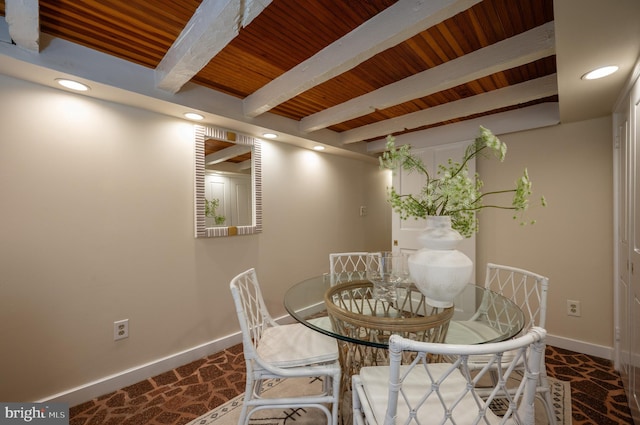 carpeted dining area featuring wood ceiling, baseboards, beam ceiling, and recessed lighting