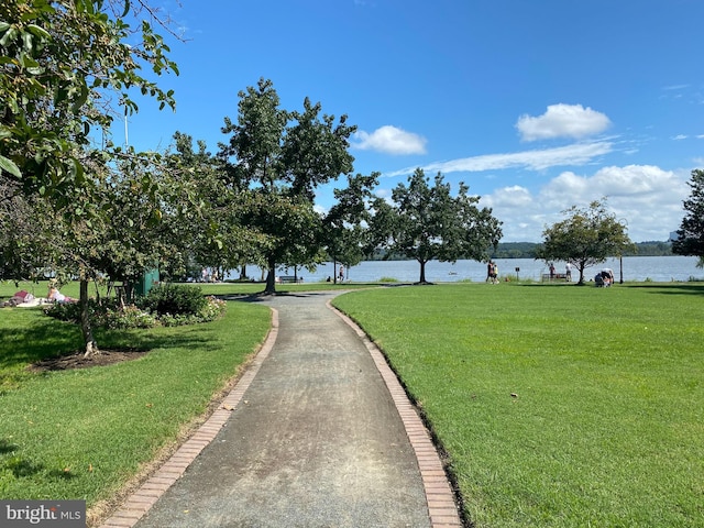 view of street featuring curbs and a water view