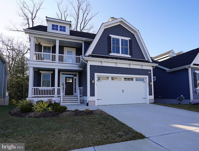 view of front of home with a porch, a garage, a balcony, and a front lawn