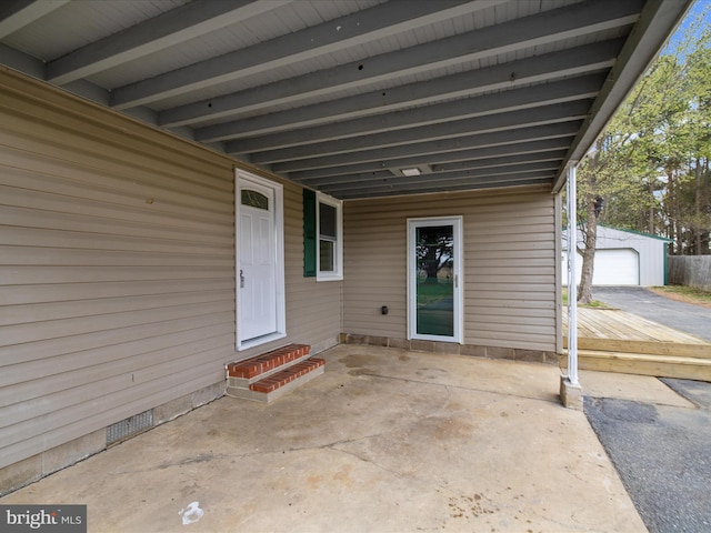 view of exterior entry with a garage