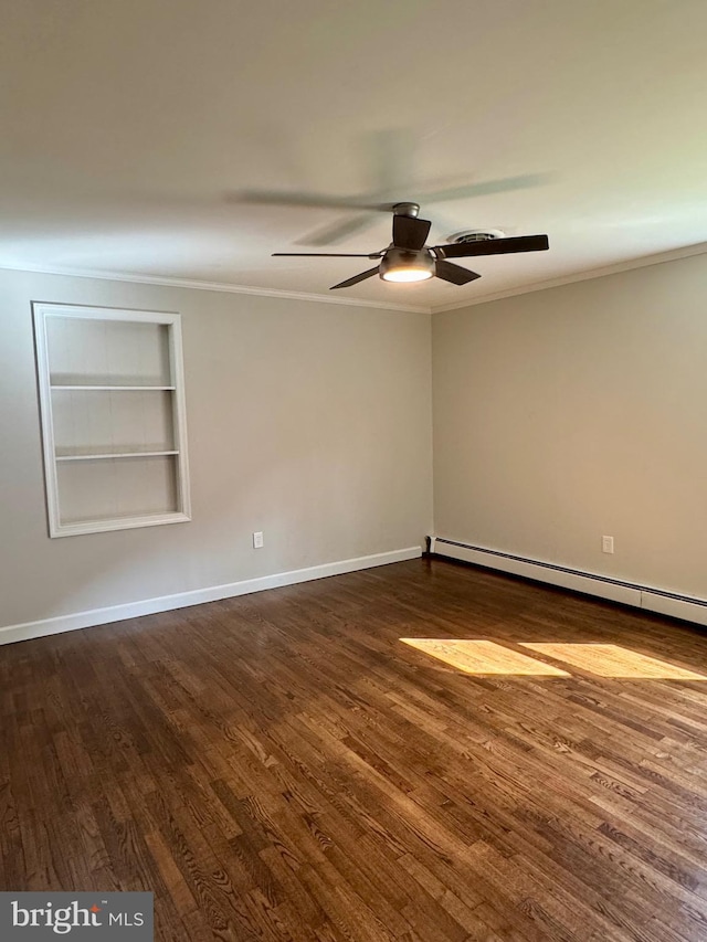 empty room featuring dark wood-type flooring, ceiling fan, built in shelves, and crown molding