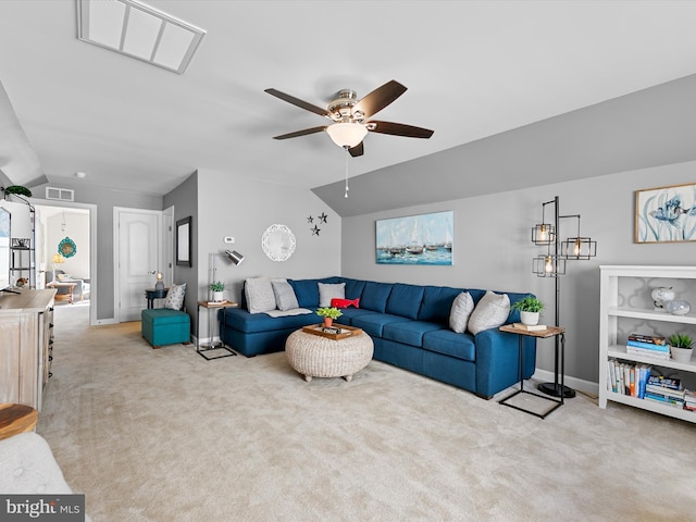 living area featuring light carpet, vaulted ceiling, and visible vents