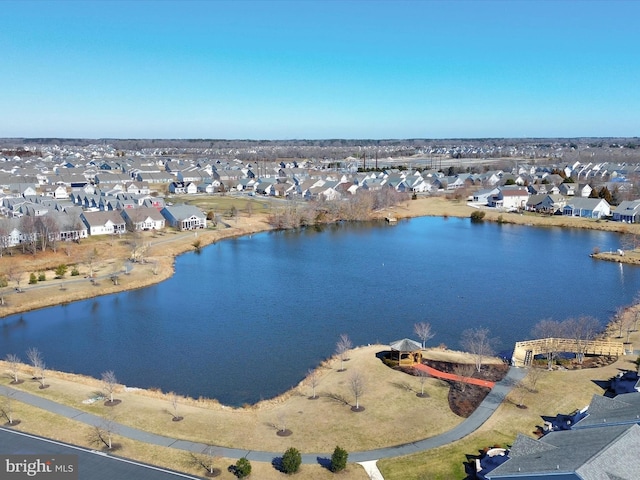 aerial view with a residential view and a water view