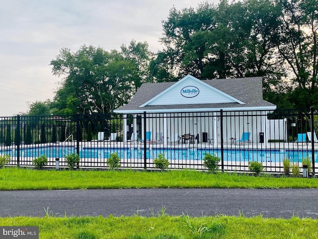 community pool featuring fence