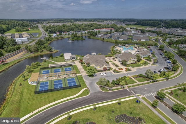 drone / aerial view featuring a water view and a residential view