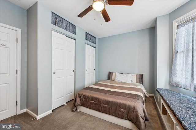 bedroom with dark colored carpet and ceiling fan