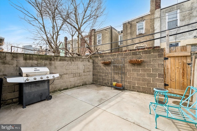 view of patio featuring a grill