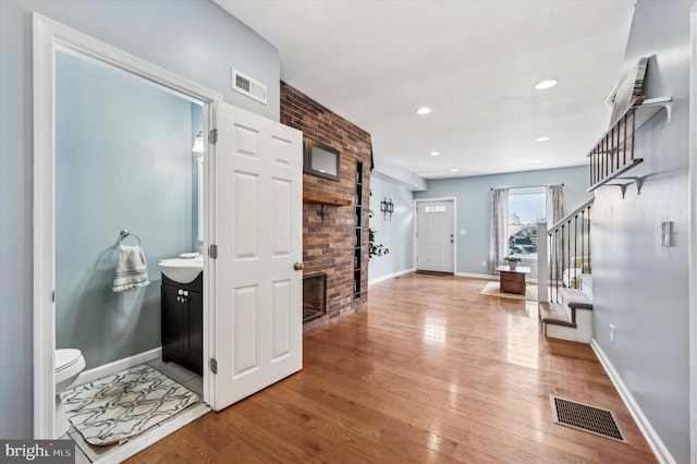 foyer featuring hardwood / wood-style flooring and sink