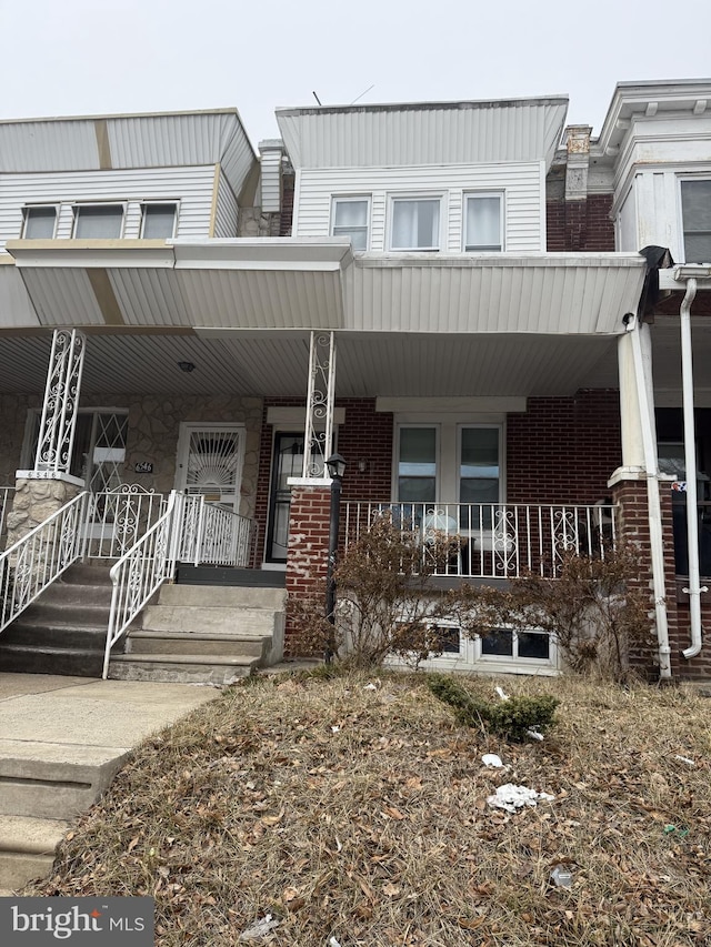 view of property with a porch