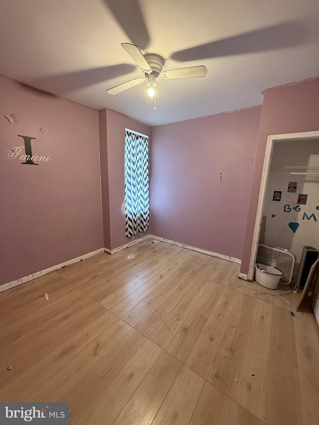 spare room with light hardwood / wood-style floors and ceiling fan