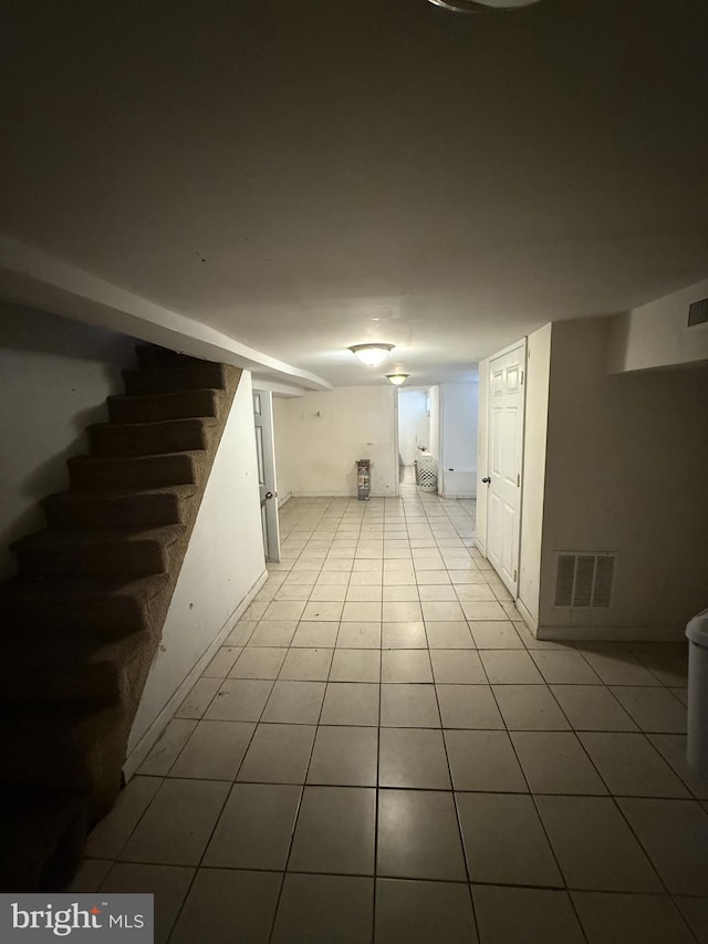 basement with light tile patterned floors