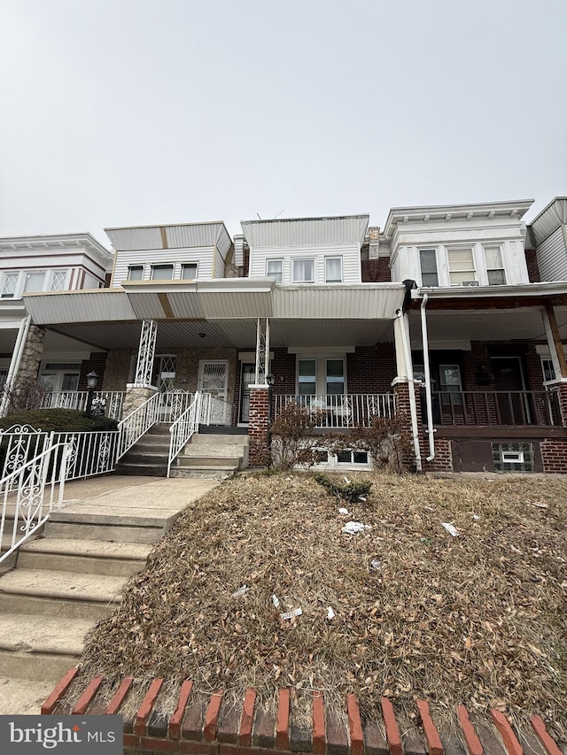 view of property with a porch