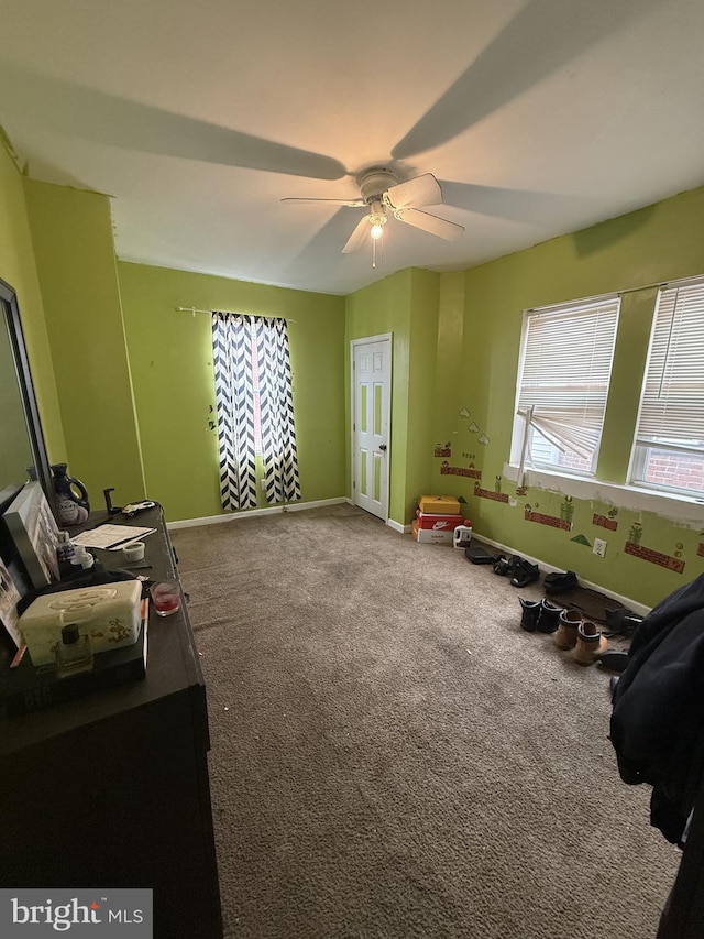 rec room featuring ceiling fan and carpet flooring