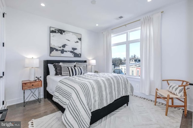 bedroom with wood-type flooring