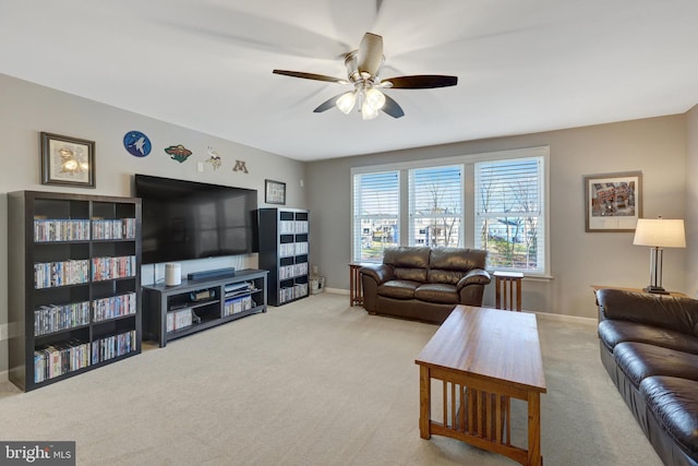 living room featuring light carpet and ceiling fan