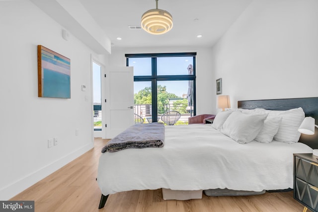 bedroom with light hardwood / wood-style floors