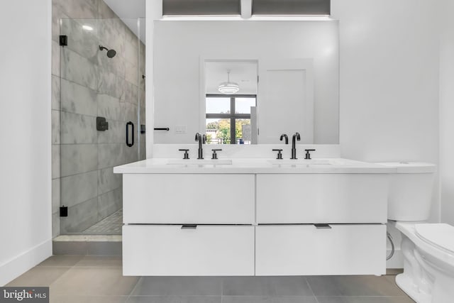 bathroom featuring vanity, an enclosed shower, and tile patterned flooring