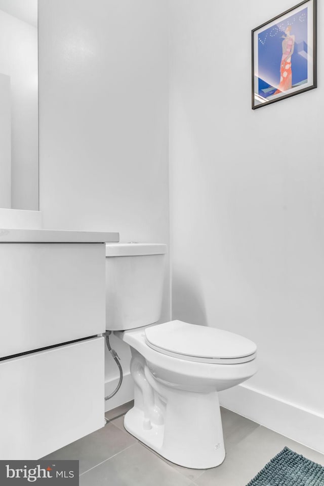 bathroom with tile patterned floors and toilet