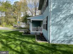 view of yard with covered porch